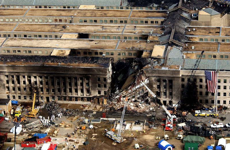Aerial view of the collapsed section of the Pentagon with emergency crews working below, September 14, 2001