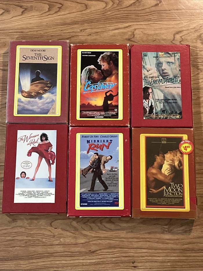 A group of six VHS clamshell cases from a private Erol's-era video collection